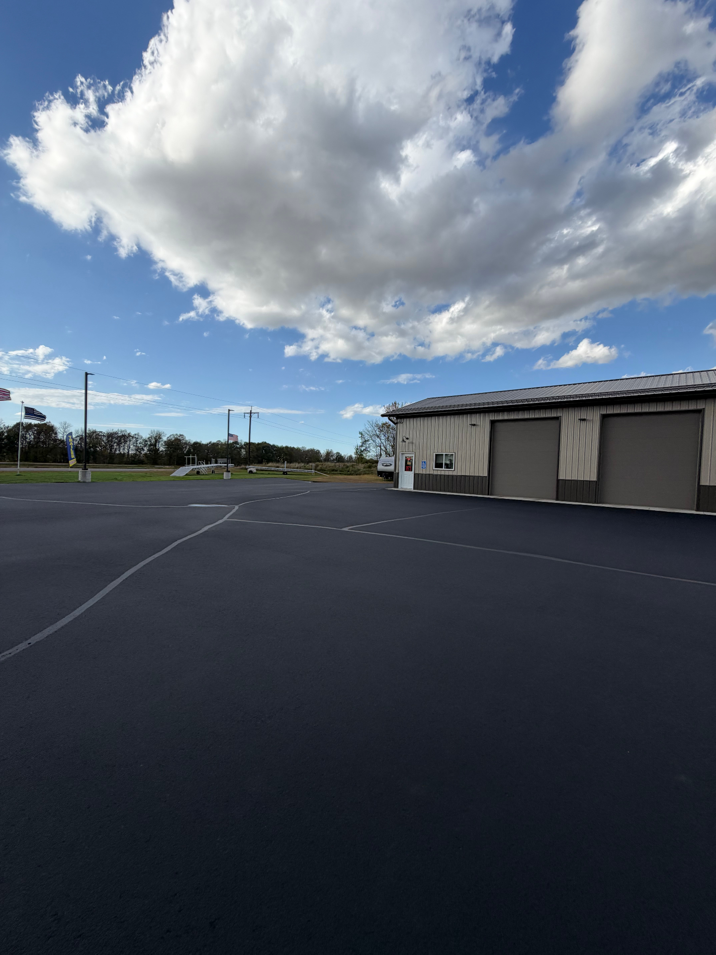 Freshly seal coated commercial asphalt lot
